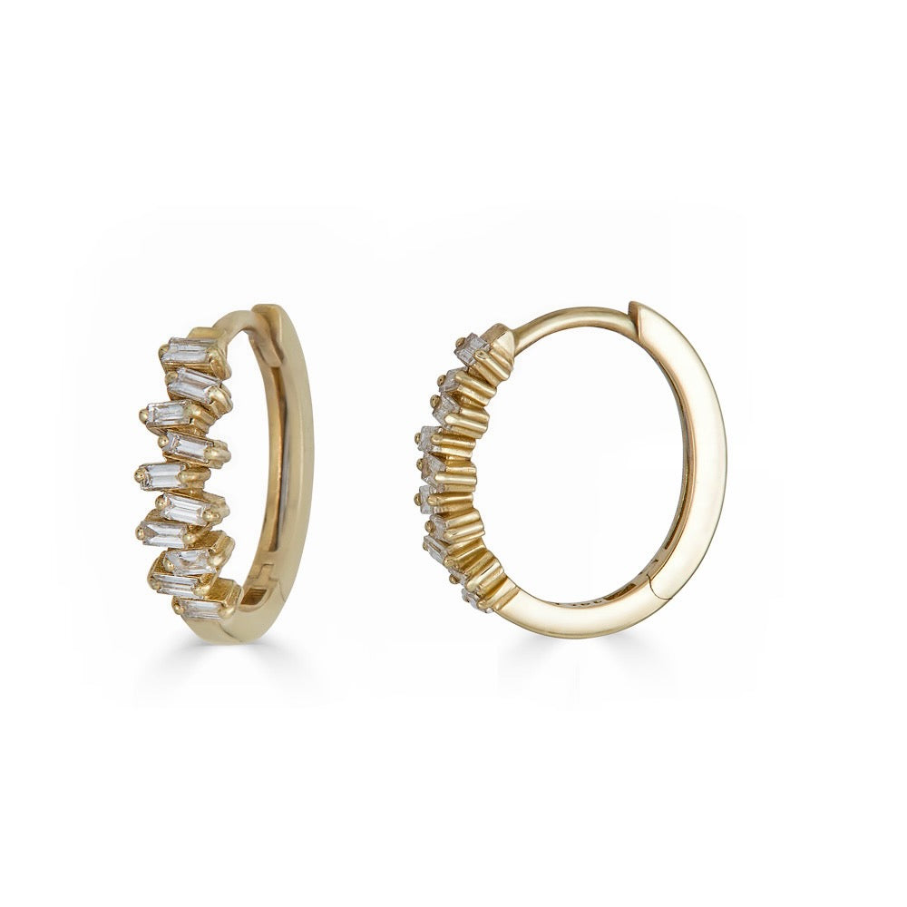 STACKED DIAMOND BAGUETTES HUGGIES-Huggies-Ten baguette diamonds are stacked together on each 14k gold hoop. With their delicate oval shape and intense shine, these baguette diamond hoops will upgrade your earring game. - available in 14k yellow and white gold - diamonds: approximately 0.25 total carat weight, G-H color, SI clarity - shown on model in yellow gold - sold as a pair-Anneaux Jewelry