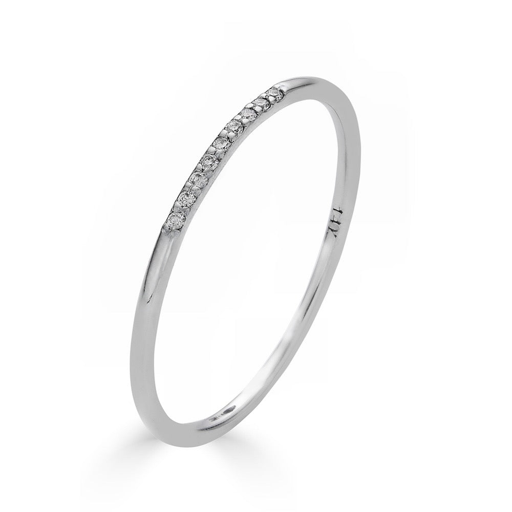 SKINNY DIAMOND BAND-Our thinnest band with just enough sparkle! This extra skinny band has micro pave diamonds one quarter of the way around. - available in 14k yellow, white and rose gold - diamonds: approximately 0.02 total carat weight; G-H color and SI clarity - shown on model in white gold - custom sizing available: ice@anneauxjewelry.com-Anneaux Jewelry