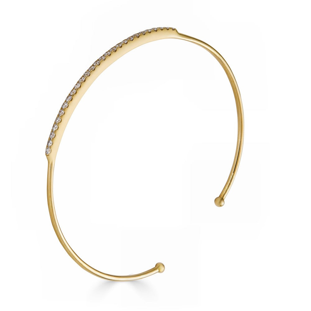 DIAMOND ROW BANGLE-Bangle-A row of diamonds sits atop this yellow gold wire bangle, wear alone or add to your wrist stack. - available in 18k yellow and white gold - 60 x 50 mm - diamonds: approximately 0.60 total carat weight; G-H color; SI clarity - shown on model in yellow gold-Anneaux Jewelry