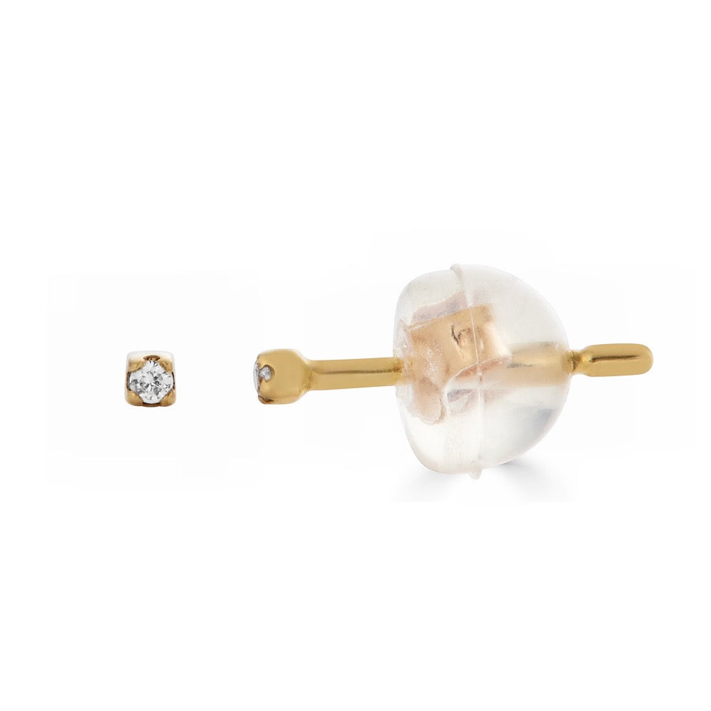 DIAMOND KISS STUD-Studs-A sweet diamond kiss for your ear set in 18k solid gold. - available in 18k yellow and white gold - diamond in single stud: approximately 0.005 total carat weight; G-H color, SI 1-2 clarity - comfort fit silicone backing - shown on model in yellow gold-Anneaux Jewelry