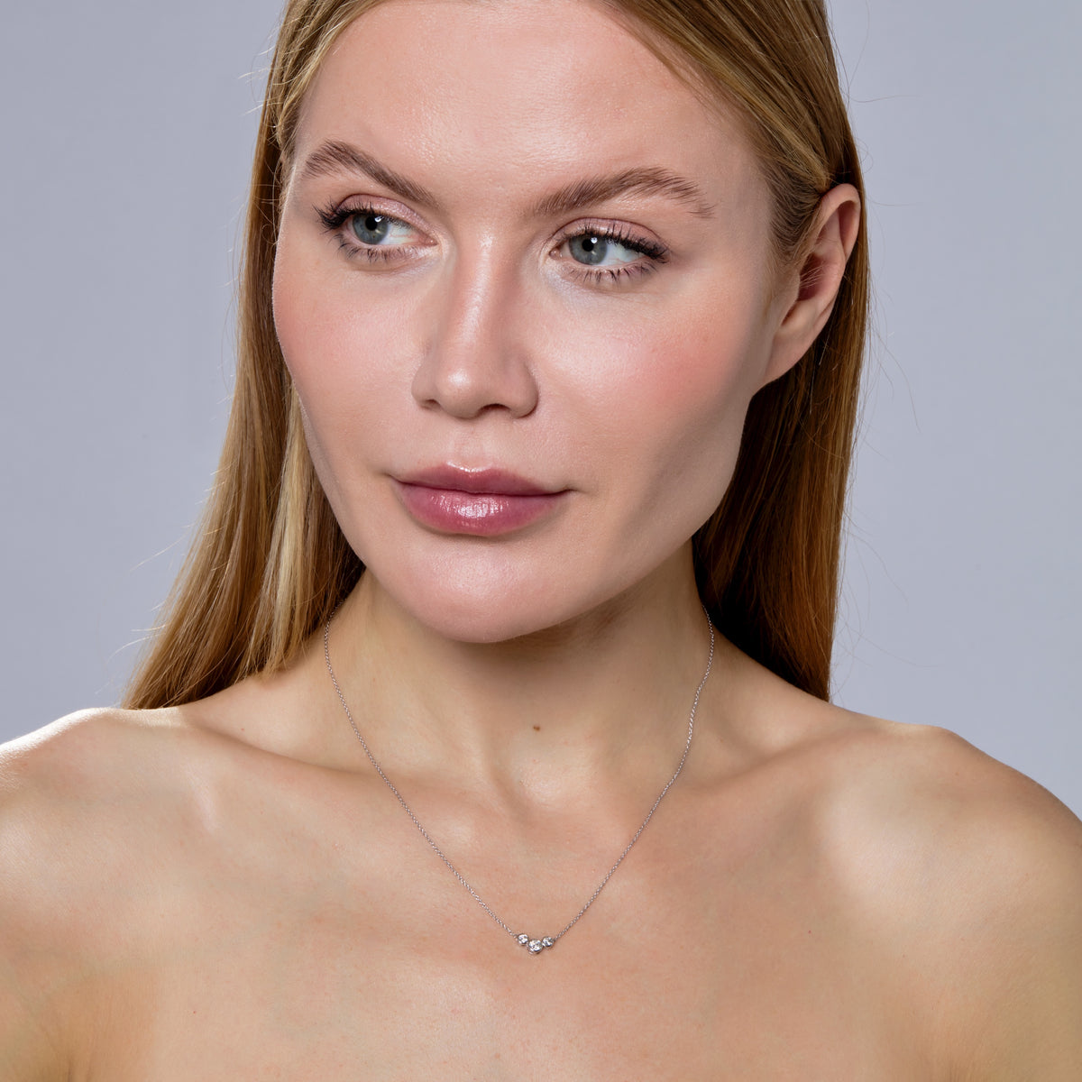 THREE DIAMOND BEZEL NECKLACE-Necklaces-We have upped the classic diamond bezel necklace by flanking it with two more diamond bezels on either side. Attached to a classic 18k gold chain, rock this every day or bust it out on a special occasion - it works both ways! - available in 18k yellow and white gold - diamonds: approximately 0.40 total carat weight; G-H color, SI clarity - 18" chain length - lobster clasp - shown on model in white gold-Anneaux Jewelry