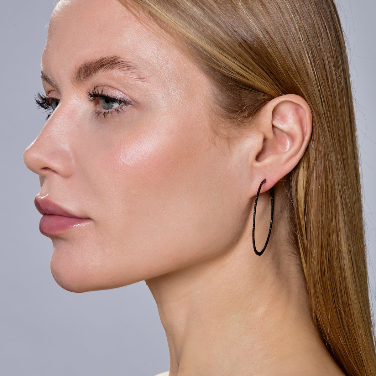 SKINNY BLACK DIAMOND & BLACK GOLD HOOPS - XL-Hoops-These are like the perfect black dress for your ears. Each extra large 14K black gold hoop earring shows off a super skinny row of black diamonds. - 14k black gold - black diamonds: approximately 0.68 total carat weight - 1 3/4" - sold as a pair-Anneaux Jewelry