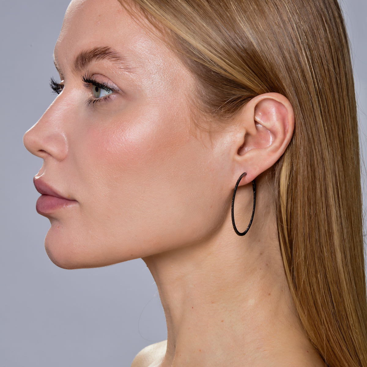 SKINNY BLACK DIAMOND & BLACK GOLD HOOPS - L-Hoops-Edgy yet sophisticated, these large black diamond hoops are set in 14k black gold with a super skinny row of black diamonds. - 14k black gold - black diamond: approximately 0.60 total carat weight - 1 1/2" - sold as a pair-Anneaux Jewelry
