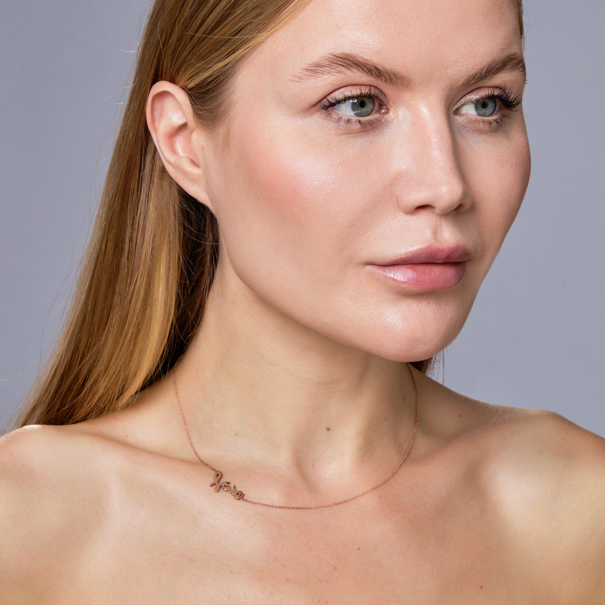 SIGNATURE “LOVE” NECKLACE-Necklaces-Love yourself! In our signature script font, handmade letters l-o-v-e are stacked to create a simple, yet powerful statement on a delicate cable link chain. - available in 14k yellow, white and rose gold - 17” necklace - spring ring clasp - shown on model in rose gold-Anneaux Jewelry