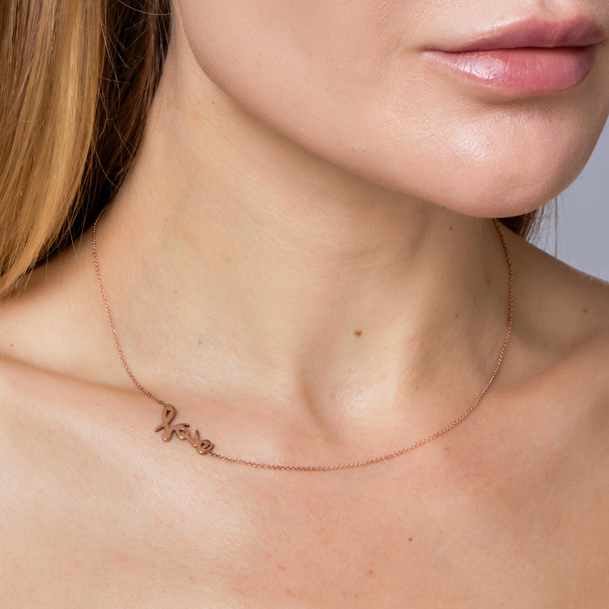SIGNATURE “LOVE” NECKLACE-Necklaces-Love yourself! In our signature script font, handmade letters l-o-v-e are stacked to create a simple, yet powerful statement on a delicate cable link chain. - available in 14k yellow, white and rose gold - 17” necklace - spring ring clasp - shown on model in rose gold-Anneaux Jewelry