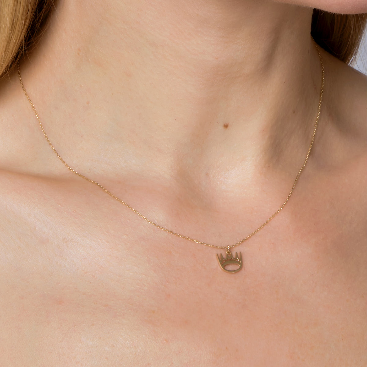 GOLD CROWN PENDANT-Charms & Pendants-For the royal in you! This 14k solid gold crown-shaped pendant hangs from a diamond cut cable link chain. - available in 14k yellow, white and rose gold - triple extendable chain: 14” - 15” - 16” - spring ring clasp - shown on model in yellow gold-Anneaux Jewelry