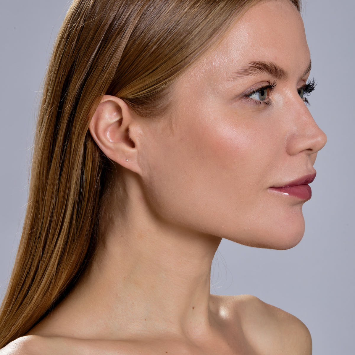 DIAMOND KISS STUD-Studs-A sweet diamond kiss for your ear set in 18k solid gold. - available in 18k yellow and white gold - diamond in single stud: approximately 0.005 total carat weight; G-H color, SI 1-2 clarity - comfort fit silicone backing - shown on model in yellow gold-Anneaux Jewelry