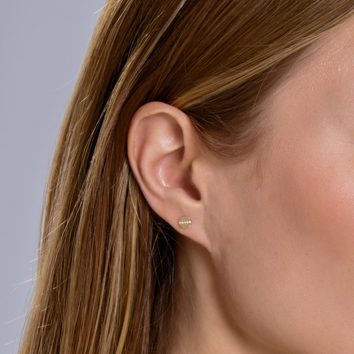 DIAMOND SCREW HEAD STUD-Studs-The head of a diamond and gold screw gives the perfect amount of edge to your lobe and certainly knows how to complete your ear game. - available in 14k yellow and white gold - diamonds in a single stud: approximately 0.02 total carat weight, G-H color, SI clarity - 14k gold butterfly backing - shown on model in yellow gold-Anneaux Jewelry